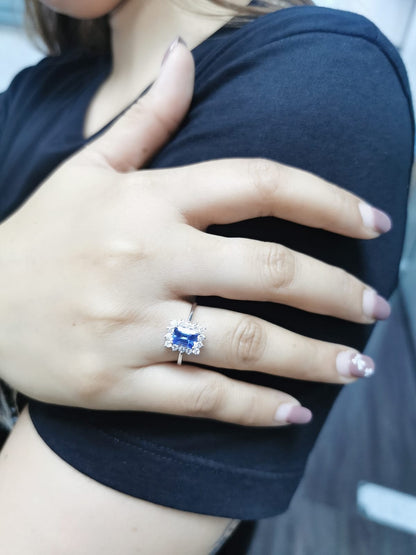 1.23 Carat Emerald-Cut Tanzanite and Diamond Halo Ring in 18K White Gold