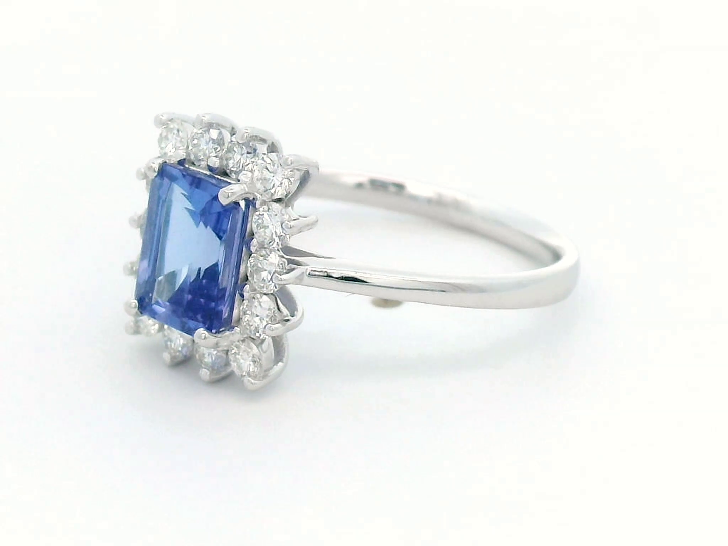 1.23 Carat Emerald-Cut Tanzanite and Diamond Halo Ring in 18K White Gold