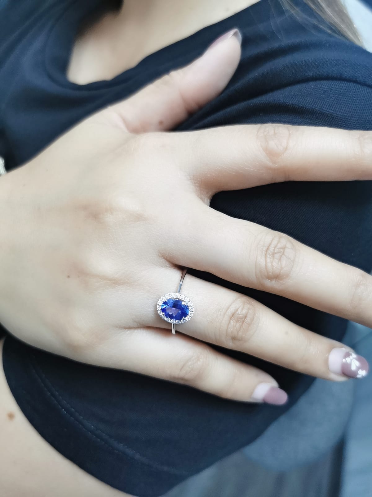 Ethereal Elegance: Oval-Cut Tanzanite and Diamond Halo Ring In 18k Gold.