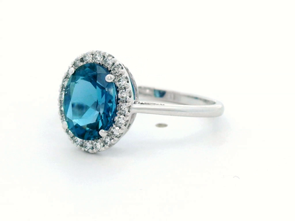 2.22 Carat London Blue Topaz Ring with Diamond Halo in 18K White Gold