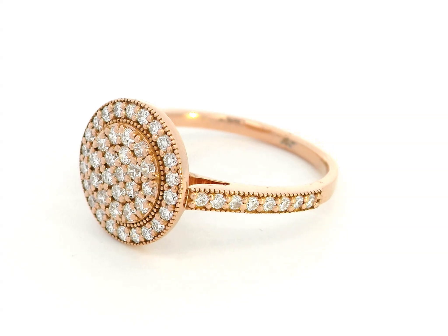 Elegant 18K rose gold diamond cluster halo ring featuring 0.61 carats of round-cut diamonds, with a double halo and pavé-set band.