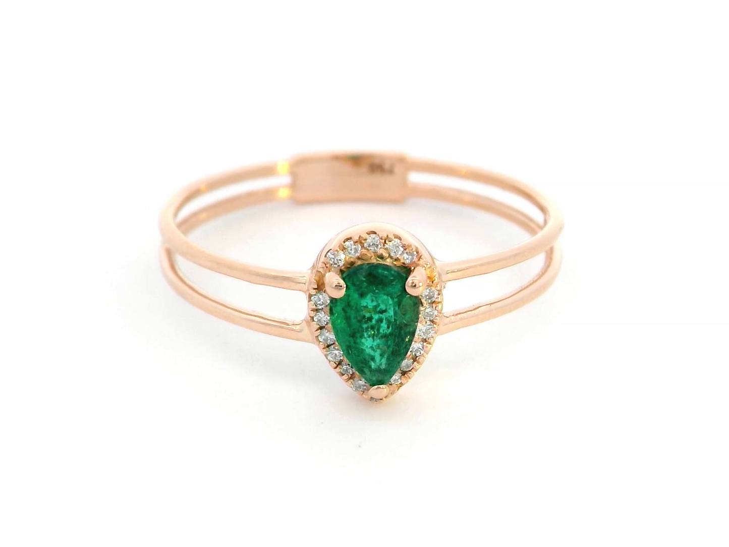 18K gold stacking-style ring with pear-cut emerald and diamond halo, featuring a split-band design for a layered look.