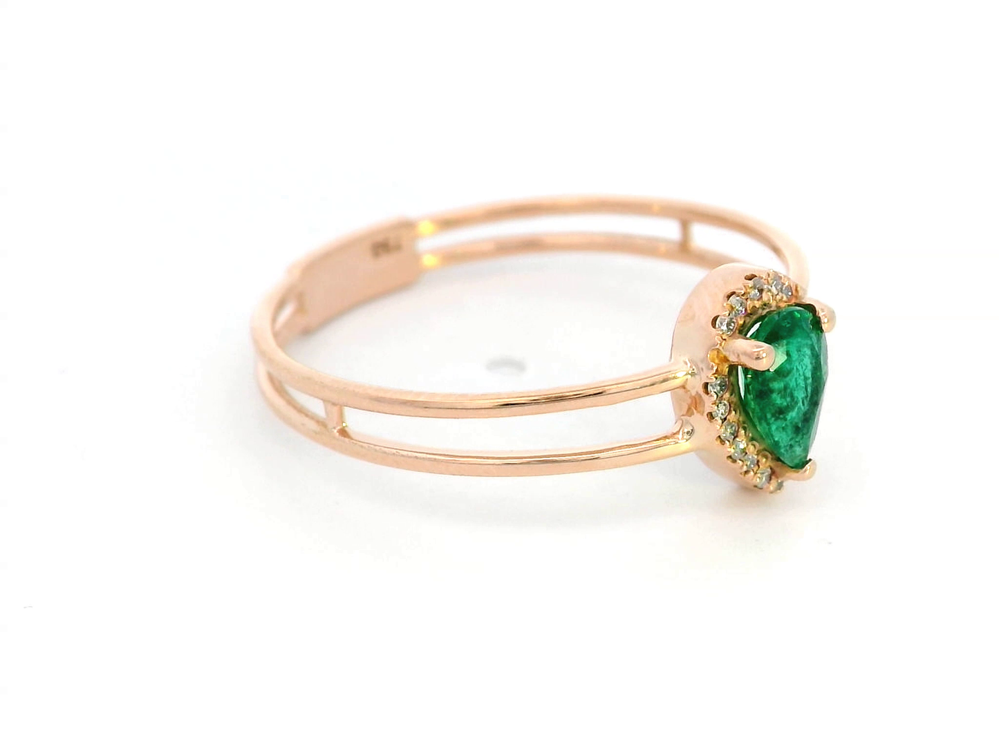 18K gold stacking-style ring with pear-cut emerald and diamond halo, featuring a split-band design for a layered look.