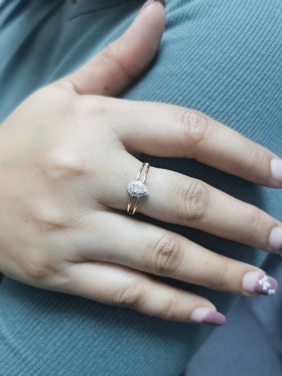 18K yellow gold pear-shaped diamond cluster ring with 0.21 carats of round diamonds in an open double-band design.