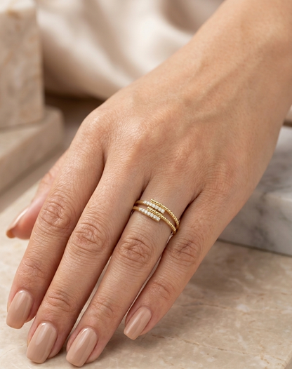 18K Yellow Gold Diamond Crossover Ring featuring 0.08 carat natural round brilliant diamonds with elegant overlapping bands and contemporary beaded detailing.