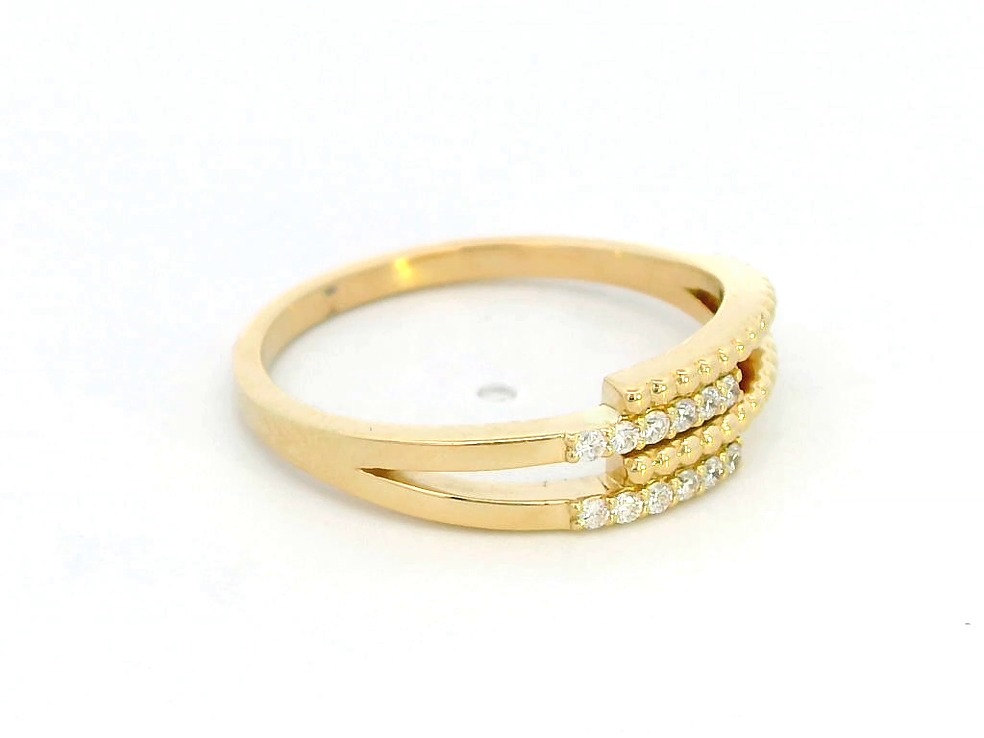 18K gold multi-band diamond ring featuring 0.08 carats of sparkling diamonds, a modern stacking-style design with polished and beaded gold details.