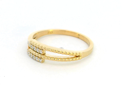 18K gold multi-band diamond ring featuring 0.08 carats of sparkling diamonds, a modern stacking-style design with polished and beaded gold details.