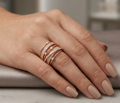 18K rose gold open wrap ring featuring multiple bands and 1.14 carats of natural round brilliant diamonds.