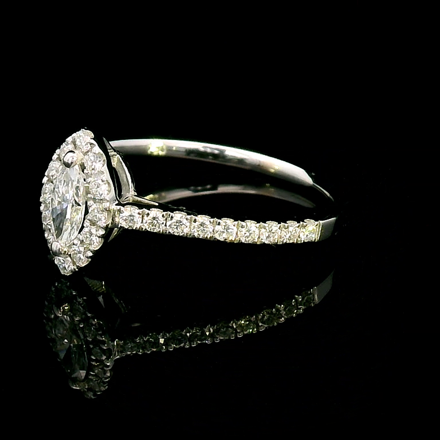 Exquisite 0.57 Carat Marquise Diamond Halo Ring with Round Cut Diamond Accents in White Gold