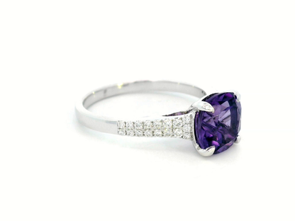 18K gold cushion-cut amethyst and diamond ring featuring a 0.92-carat amethyst with 0.21 carats of round diamonds in a four-prong setting and pave diamond band.