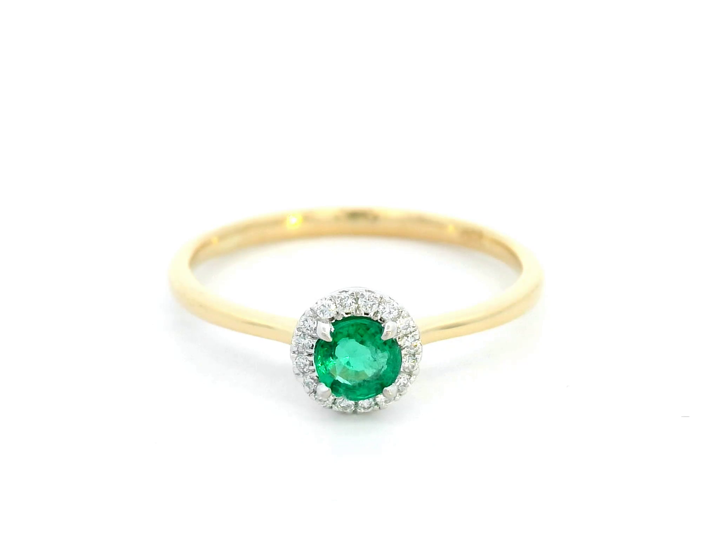 Dainty 18K gold stacking ring with a 0.25 carat emerald and 0.06 carat diamonds, perfect for fine jewelry lovers and everyday elegance.