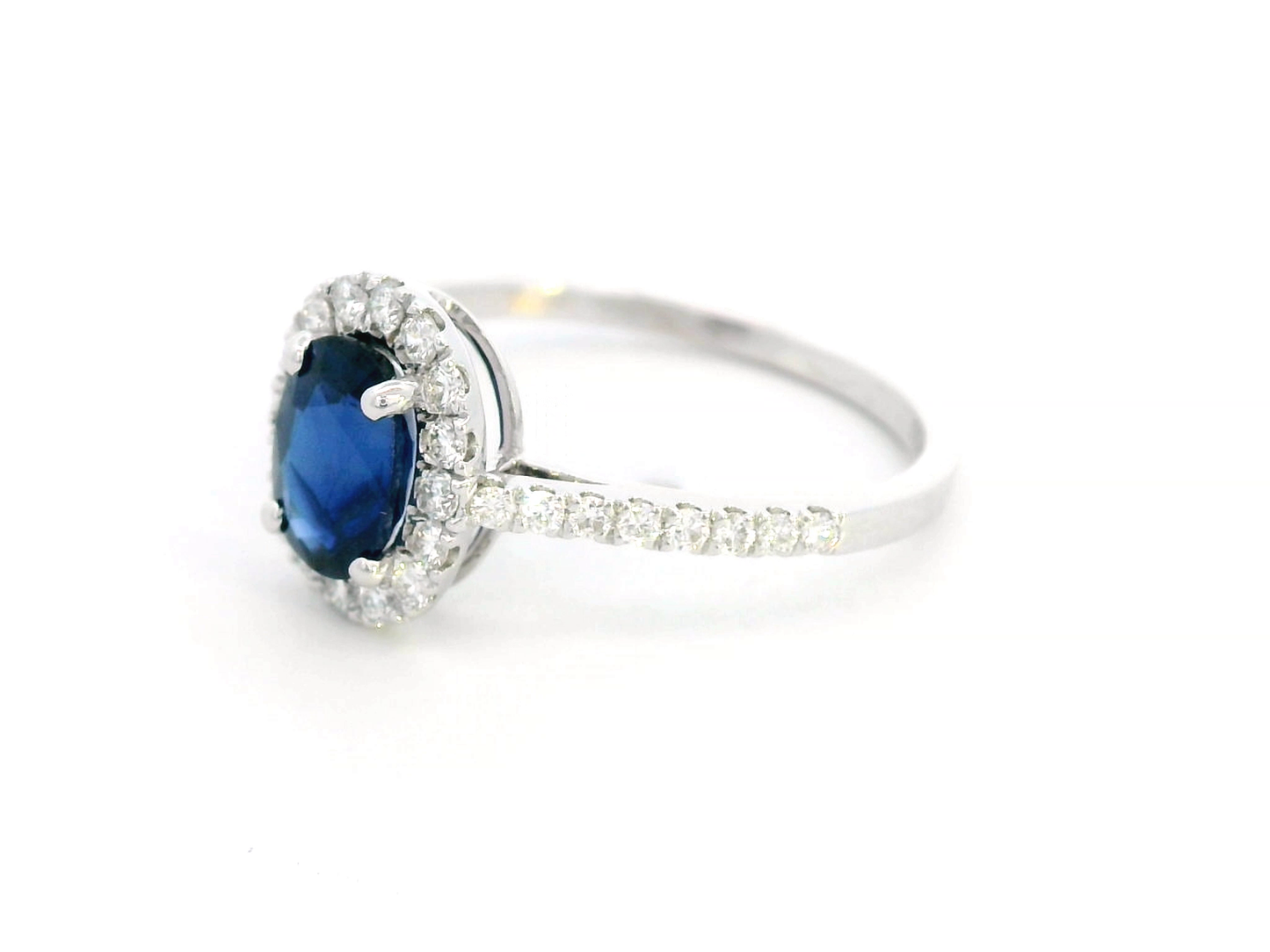 1.08 Carat Oval Sapphire Ring with Diamonds Halo in 18K Gold