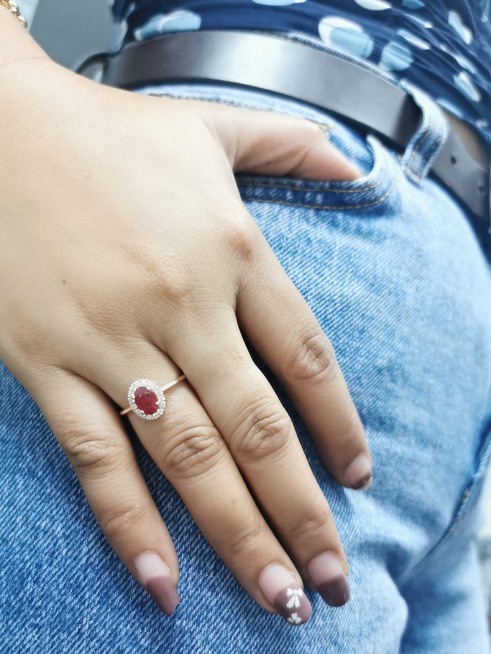 1.18 Carat Oval Ruby Ring with 0.19 Carat Diamond Halo in 18K Gold