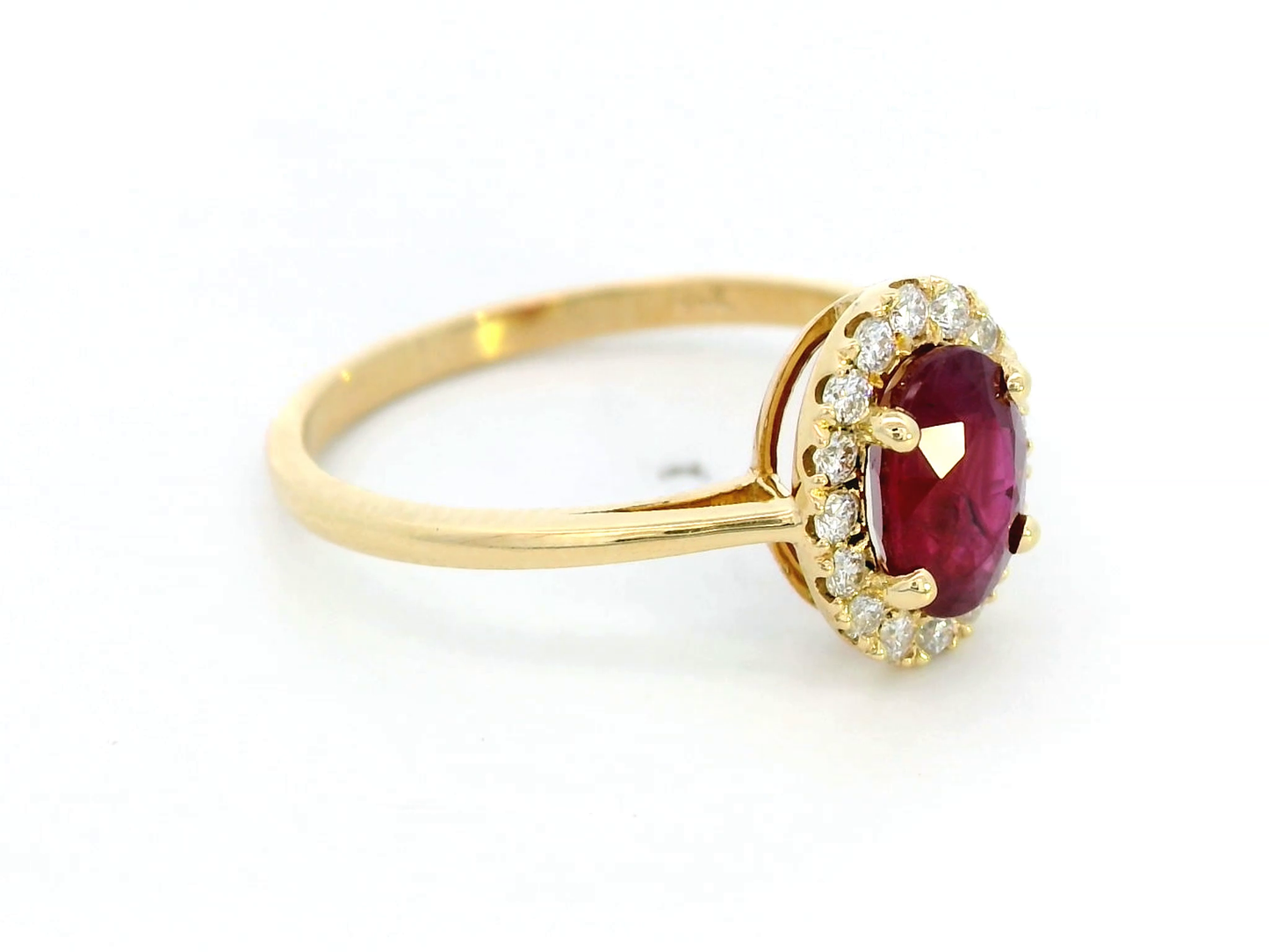 1.18 Carat Oval Ruby Ring with 0.19 Carat Diamond Halo in 18K Gold