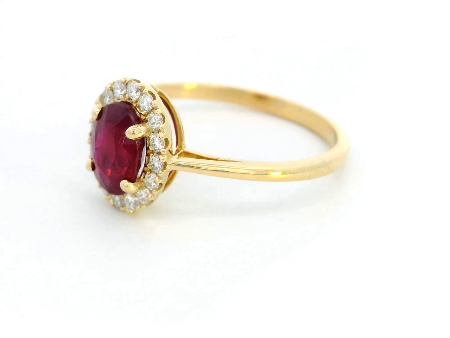 1.18 Carat Oval Ruby Ring with 0.19 Carat Diamond Halo in 18K Gold