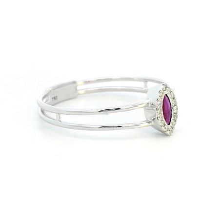 Elegant 18K gold ring featuring a marquise-cut ruby (0.14 carats) encircled by a halo of round-cut diamonds (0.05 carats) with a sleek split band design.