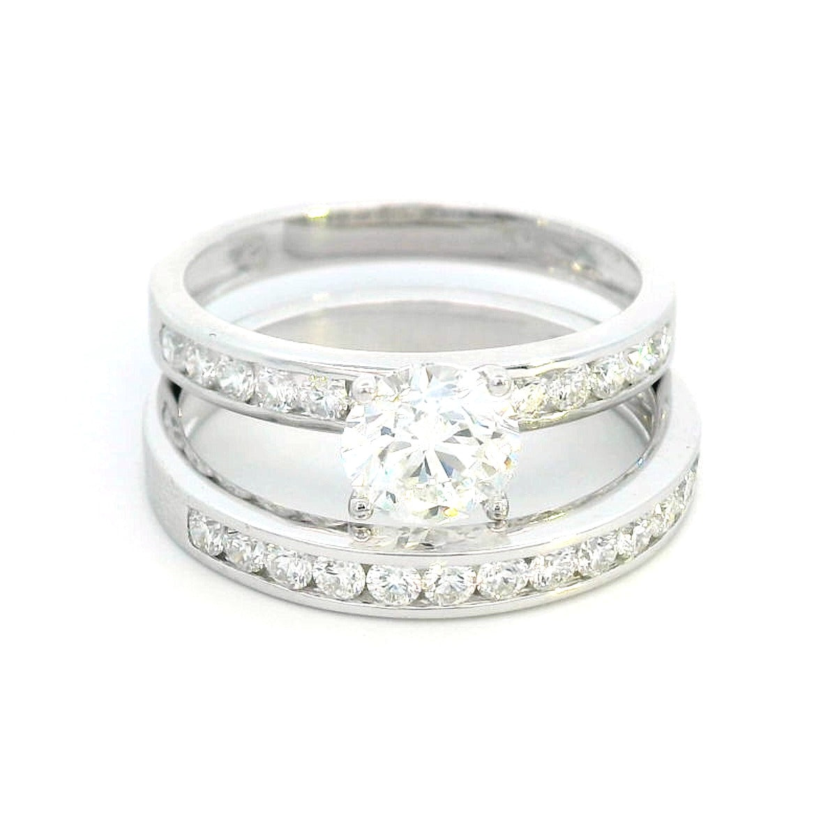 18K white gold bridal set with a 1.00-carat SI2, H-color center diamond, featuring channel-set accent diamonds totaling 0.72 carats on the engagement ring and wedding band