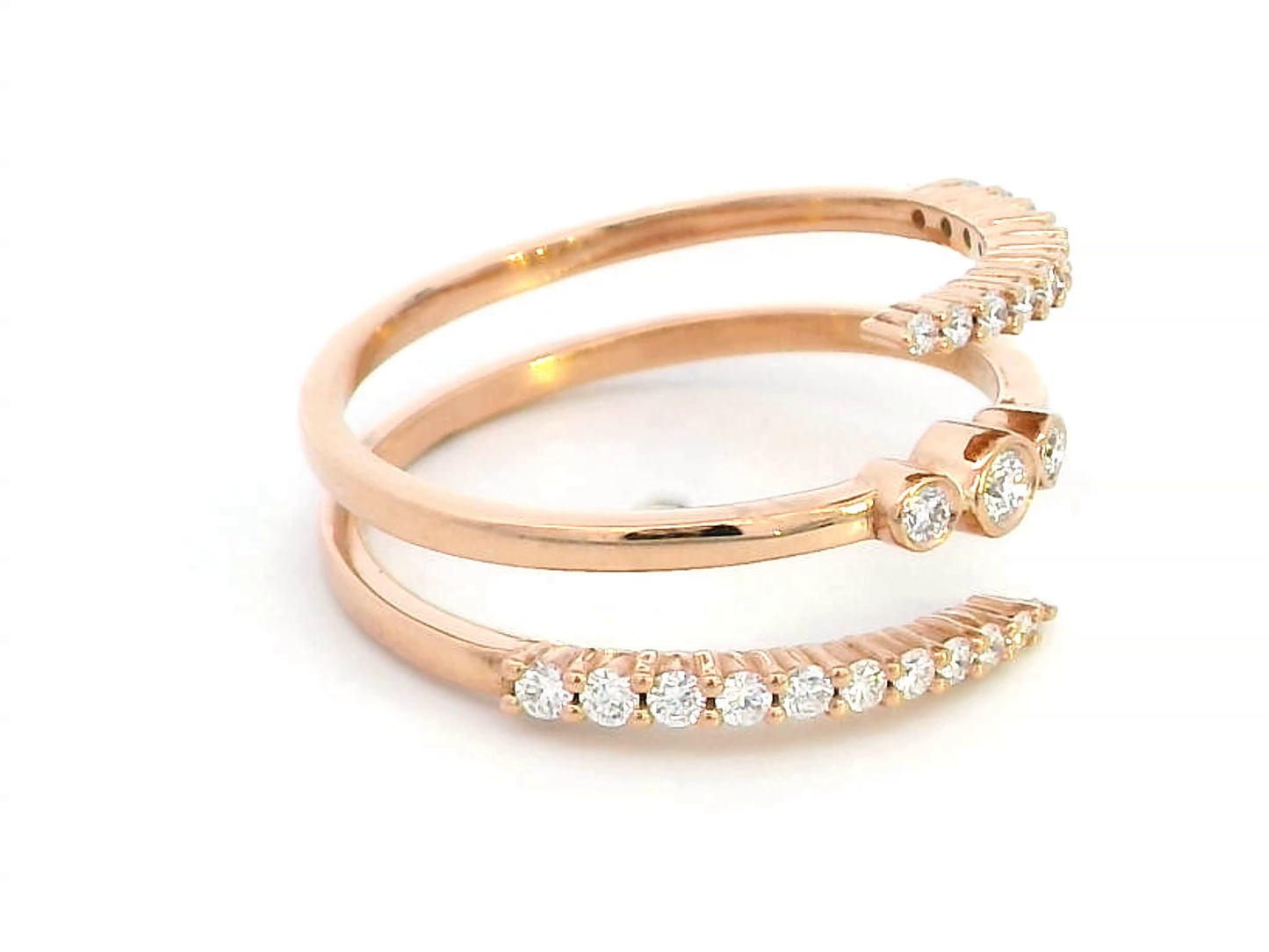 18K rose gold open wrap ring with 0.32 carats of round-cut diamonds in a modern spiral design – statement fine jewelry.