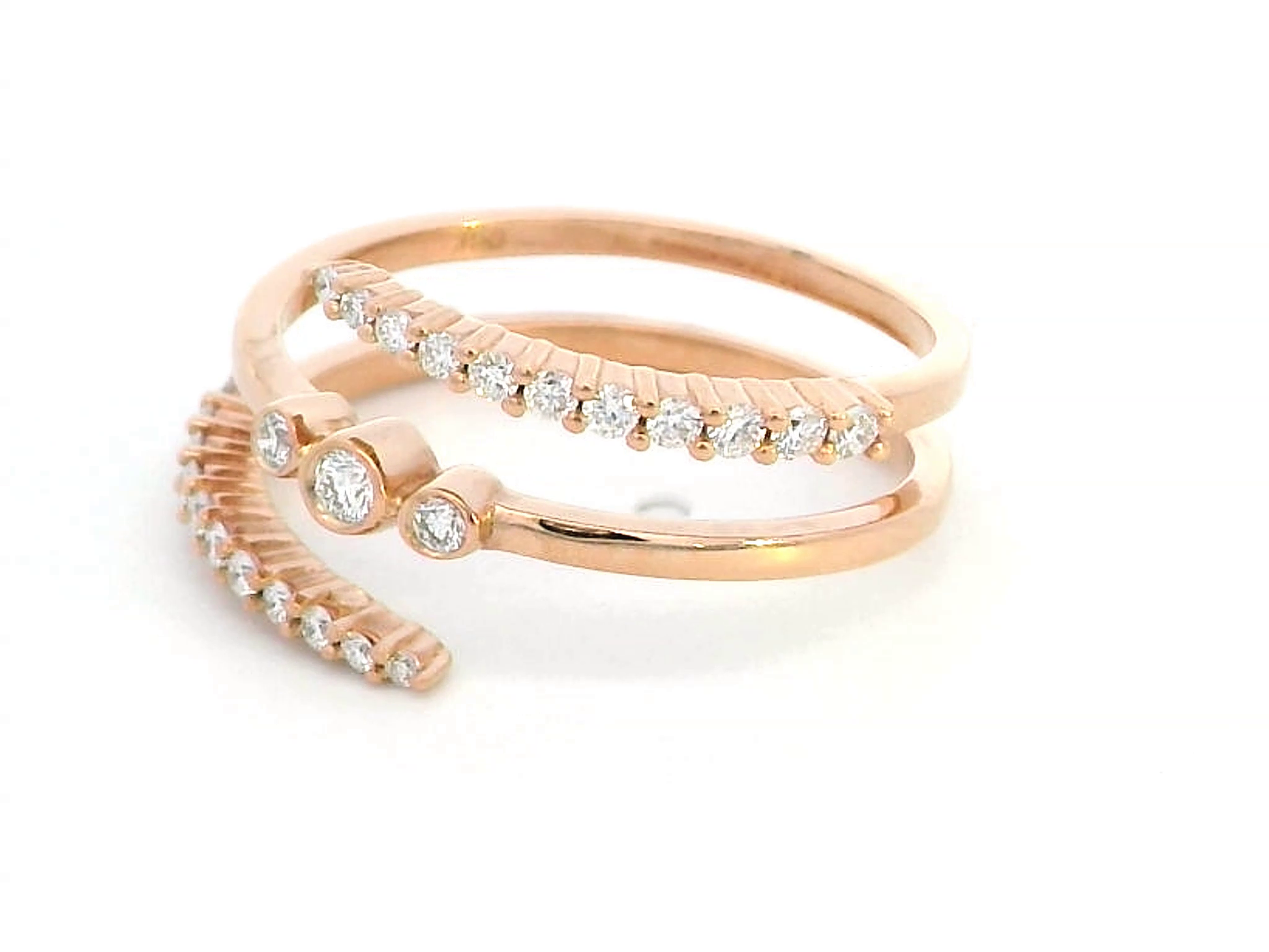 18K rose gold open wrap ring with 0.32 carats of round-cut diamonds in a modern spiral design – statement fine jewelry.