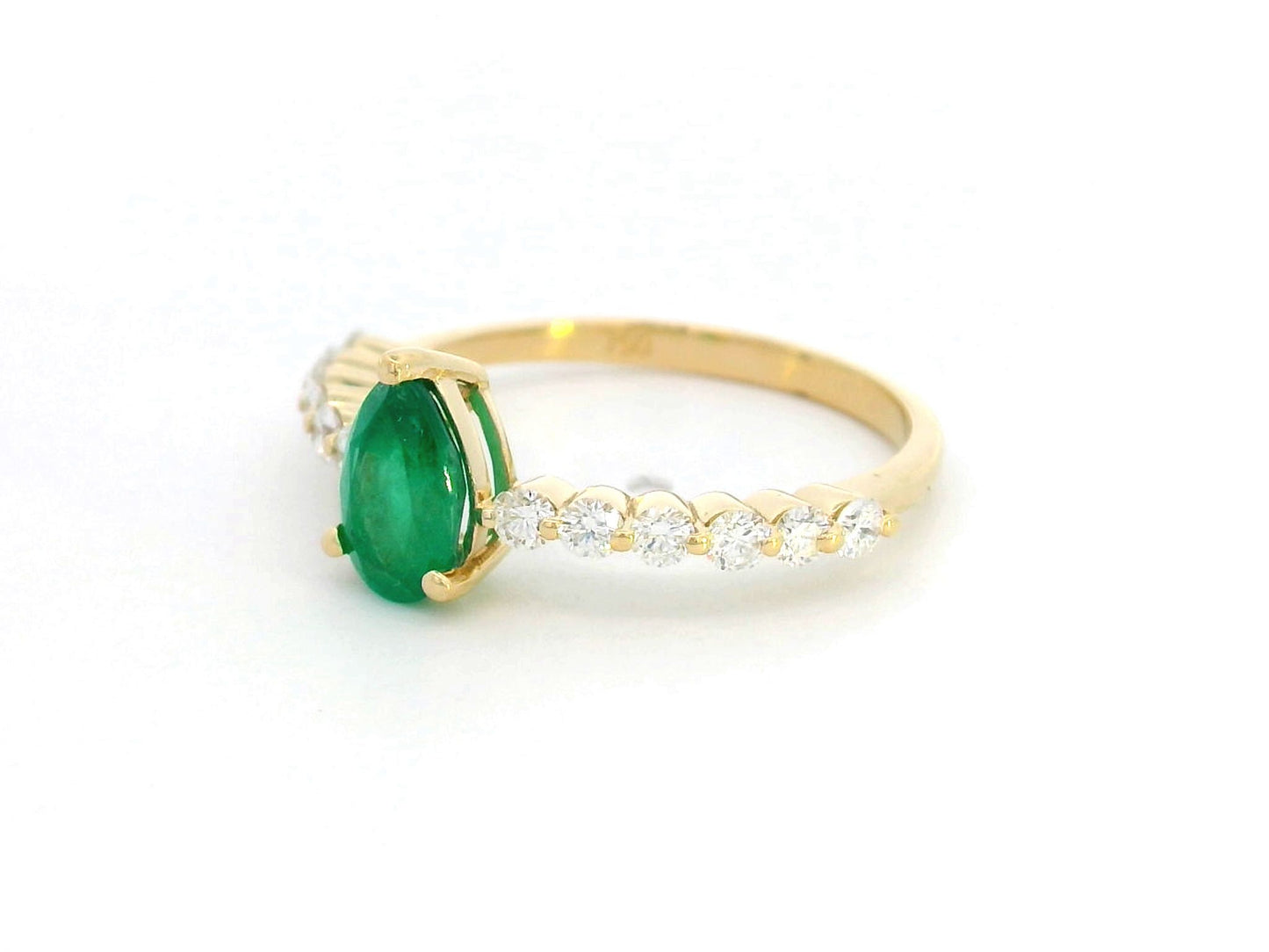 Luxurious 18K Gold Pear-Cut Emerald Ring with Diamonds on the band