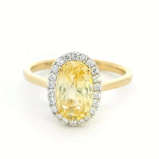 Elegant 18K Yellow Gold Ring with 3.41 Carat Oval Yellow Sapphire & Diamond Halo