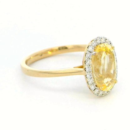 Elegant 18K Yellow Gold Ring with 3.41 Carat Oval Yellow Sapphire & Diamond Halo