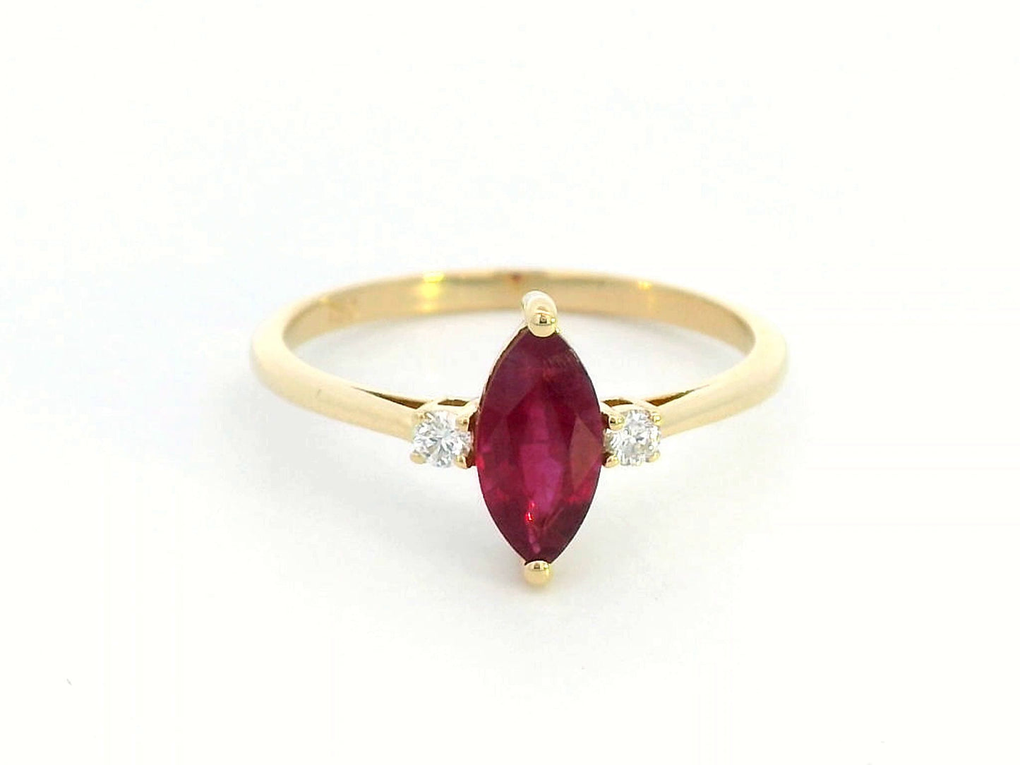 18K yellow gold ring with 0.97 carat marquise ruby and diamond accents"