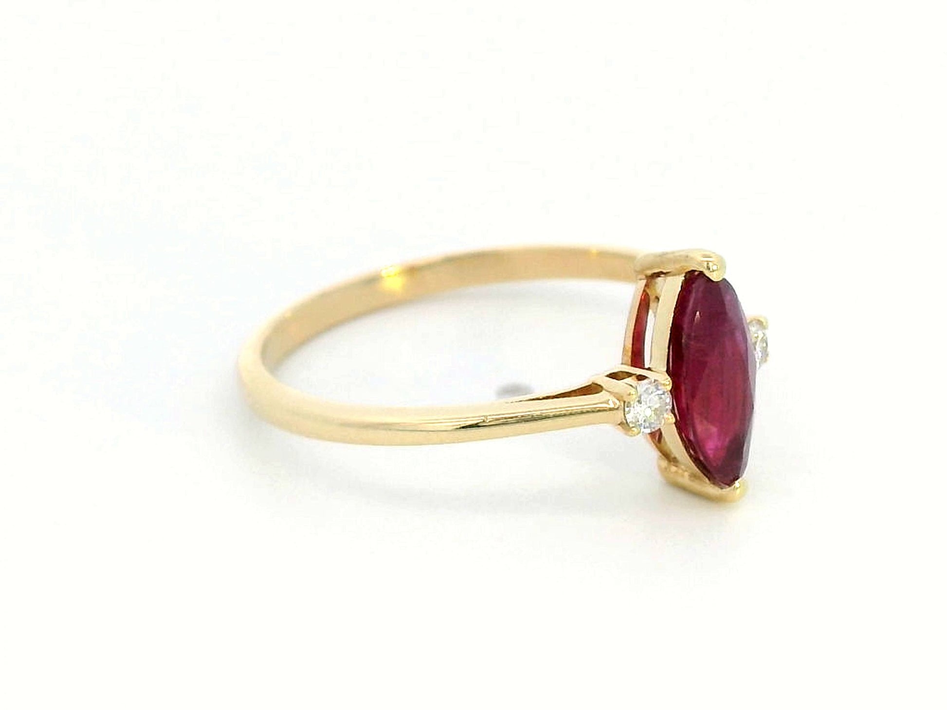 18K yellow gold ring with 0.97 carat marquise ruby and diamond accents"