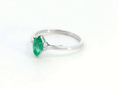 18K gold marquise emerald ring with diamond accents"