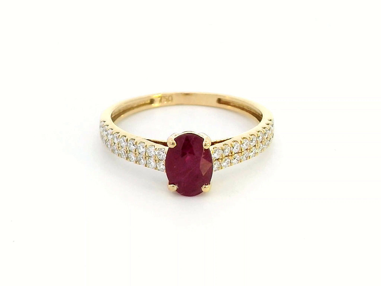 Shop this 18K gold ring featuring a 1.14-carat oval ruby and 0.33 carats of diamonds. Perfect for anniversaries, engagements, or as a stunning July birthstone gift."