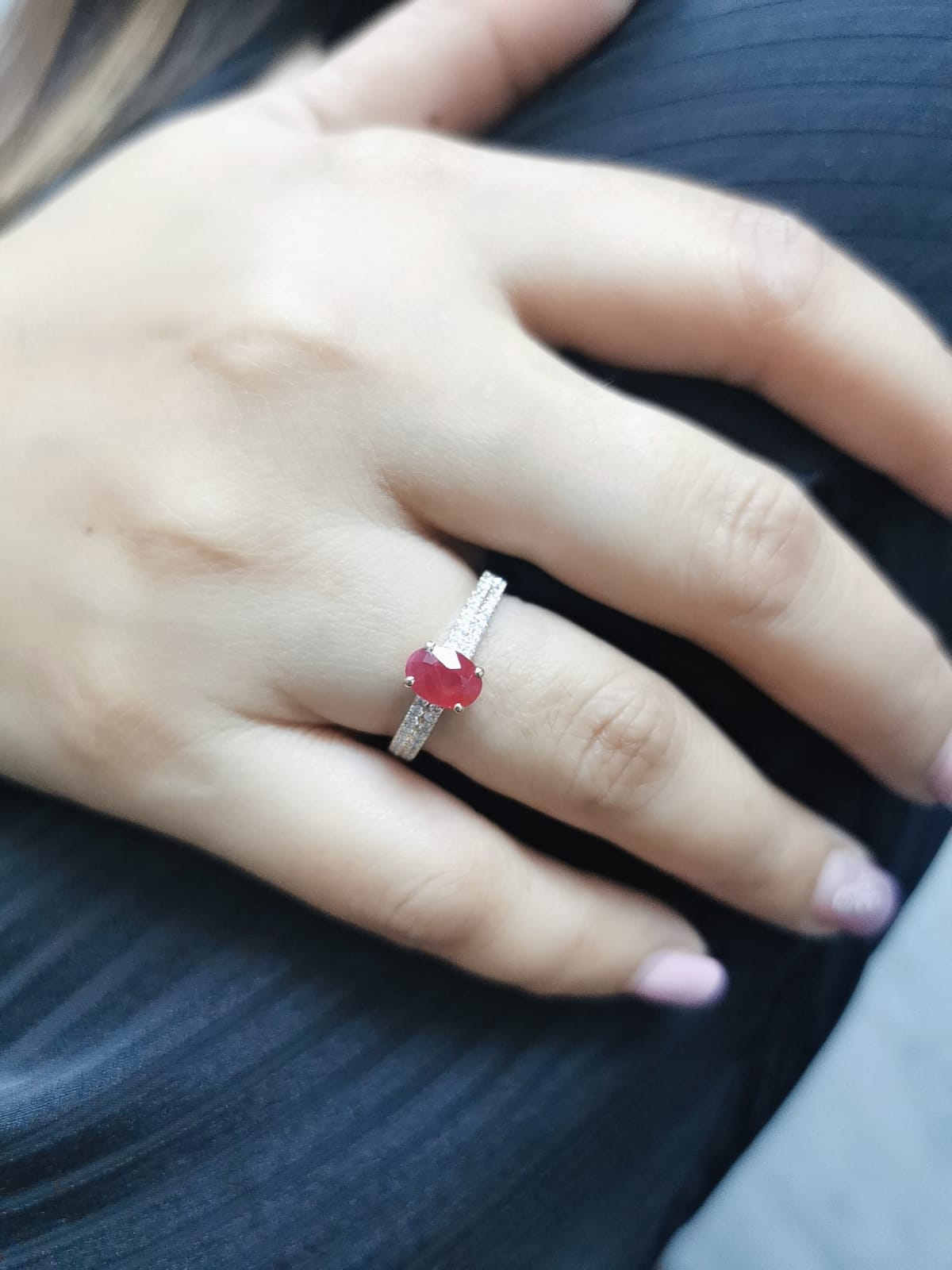 Shop this 18K gold ring featuring a 1.14-carat oval ruby and 0.33 carats of diamonds. Perfect for anniversaries, engagements, or as a stunning July birthstone gift."