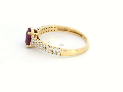 Shop this 18K gold ring featuring a 1.14-carat oval ruby and 0.33 carats of diamonds. Perfect for anniversaries, engagements, or as a stunning July birthstone gift."