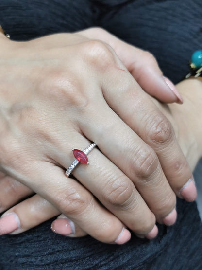  18K white gold marquise ruby and diamond ring featuring a 0.97-carat ruby and 0.21 carats of diamonds, symbolizing the July birthstone.