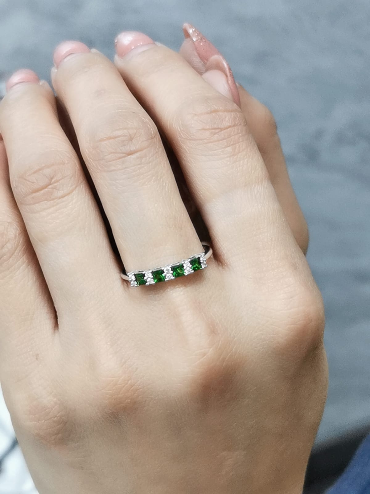 Princess-cut tsavorite and diamond ring in 18K white gold, elegant January birthstone jewelry.