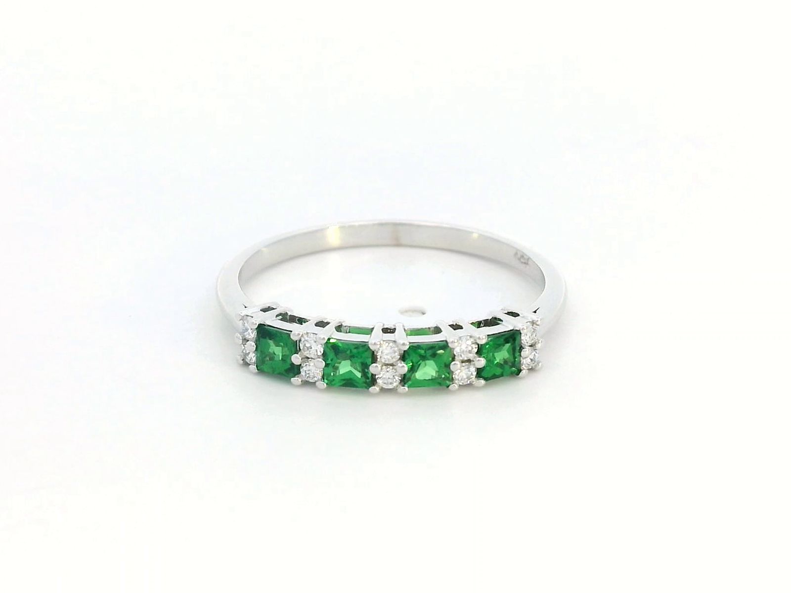 Princess-cut tsavorite and diamond ring in 18K white gold, elegant January birthstone jewelry.