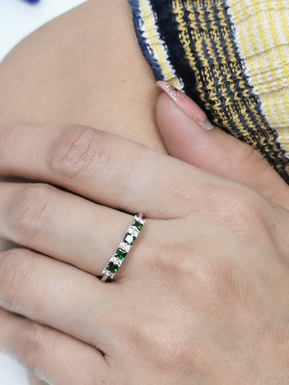 Princess-cut tsavorite and diamond ring in 18K white gold, elegant January birthstone jewelry.