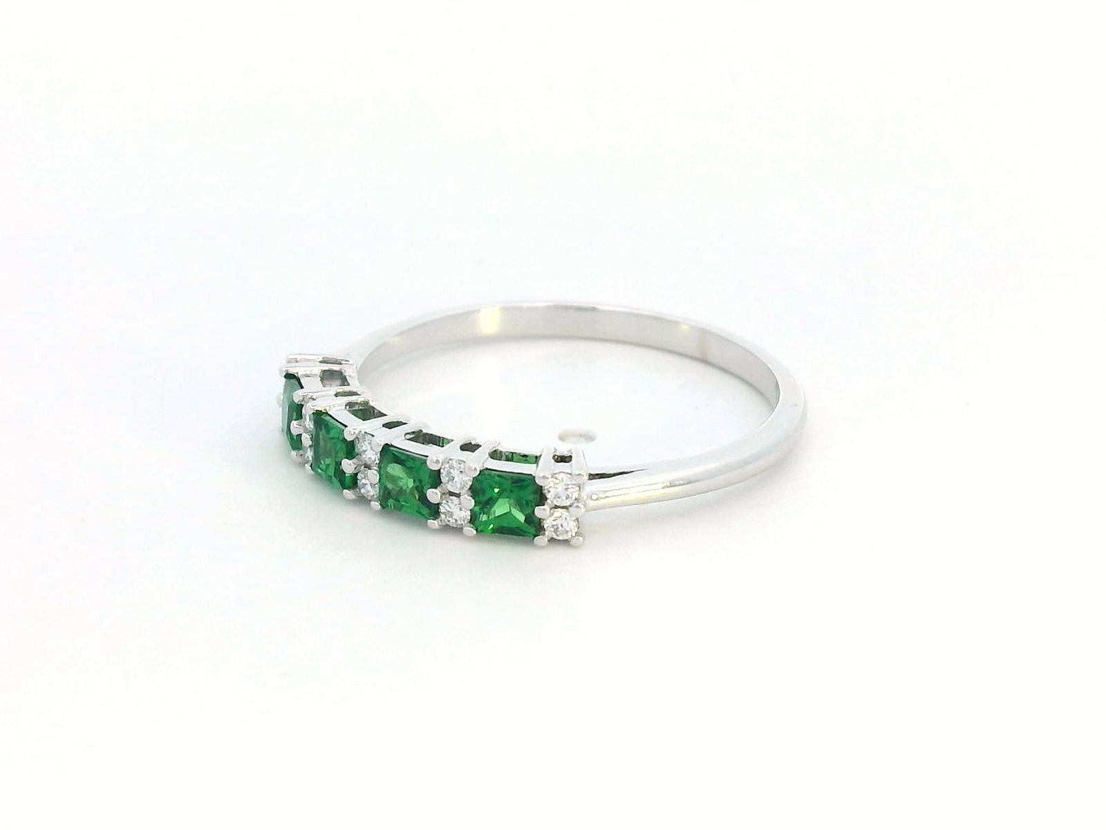 Princess-cut tsavorite and diamond ring in 18K white gold, elegant January birthstone jewelry.