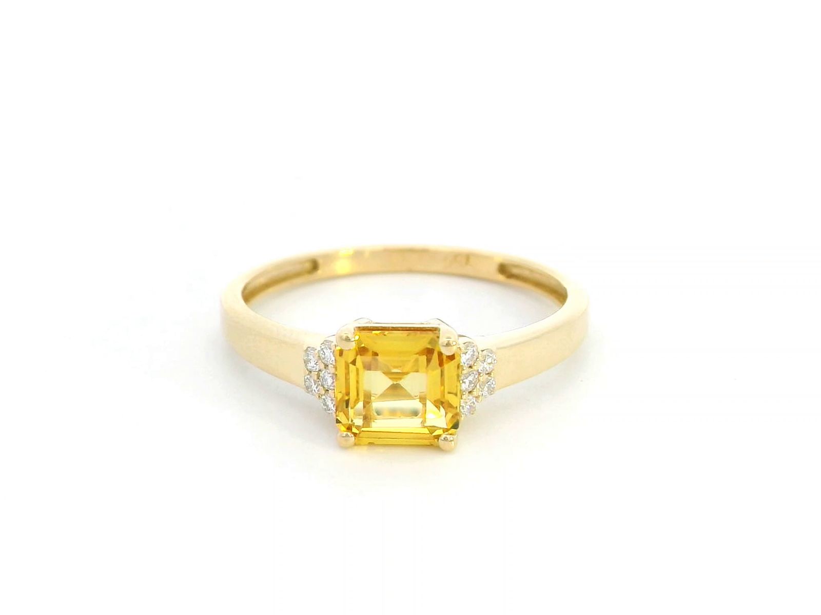 18K yellow gold ring with a radiant-cut 1.19-carat yellow sapphire and 0.08 carats of round diamonds, a timeless September birthstone jewelry design.