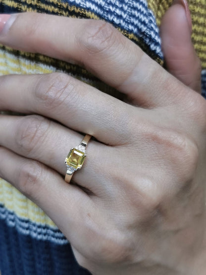 18K yellow gold ring with a radiant-cut 1.19-carat yellow sapphire and 0.08 carats of round diamonds, a timeless September birthstone jewelry design.