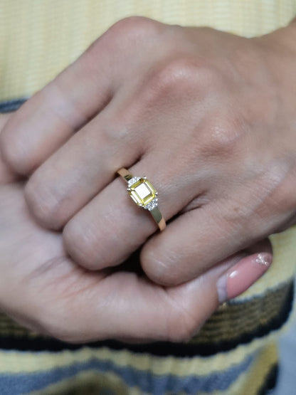 18K yellow gold ring with a radiant-cut 1.19-carat yellow sapphire and 0.08 carats of round diamonds, a timeless September birthstone jewelry design.