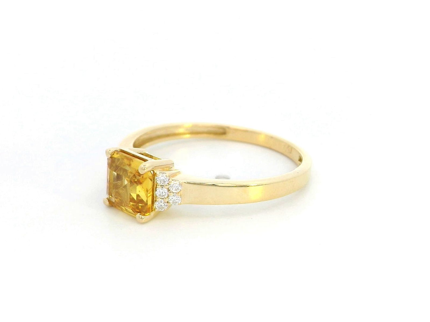 18K yellow gold ring with a radiant-cut 1.19-carat yellow sapphire and 0.08 carats of round diamonds, a timeless September birthstone jewelry design.