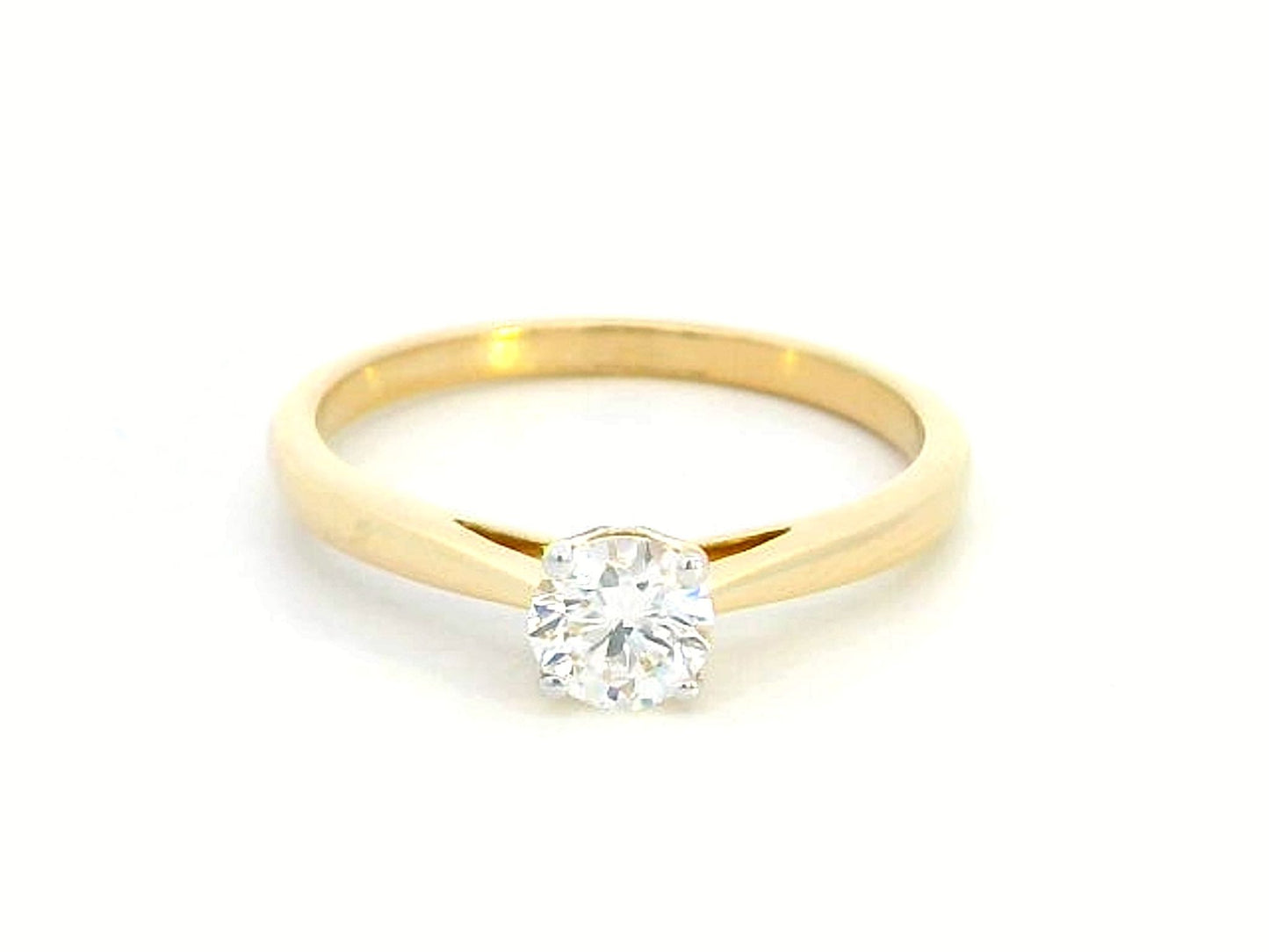 18K yellow gold solitaire ring featuring a 0.46 carat round brilliant diamond in a four-prong setting,