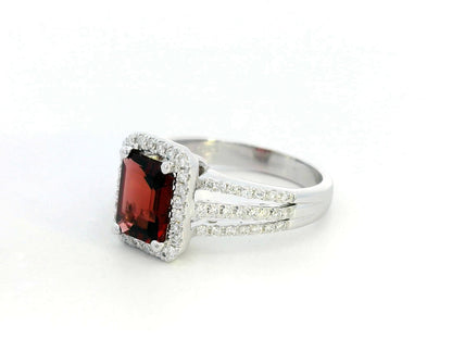 Emerald-cut 1.68-carat Garnet ring with 0.38-carat diamond halo and split-shank design in 18K gold – January birthstone engagement ring or statement jewelry.