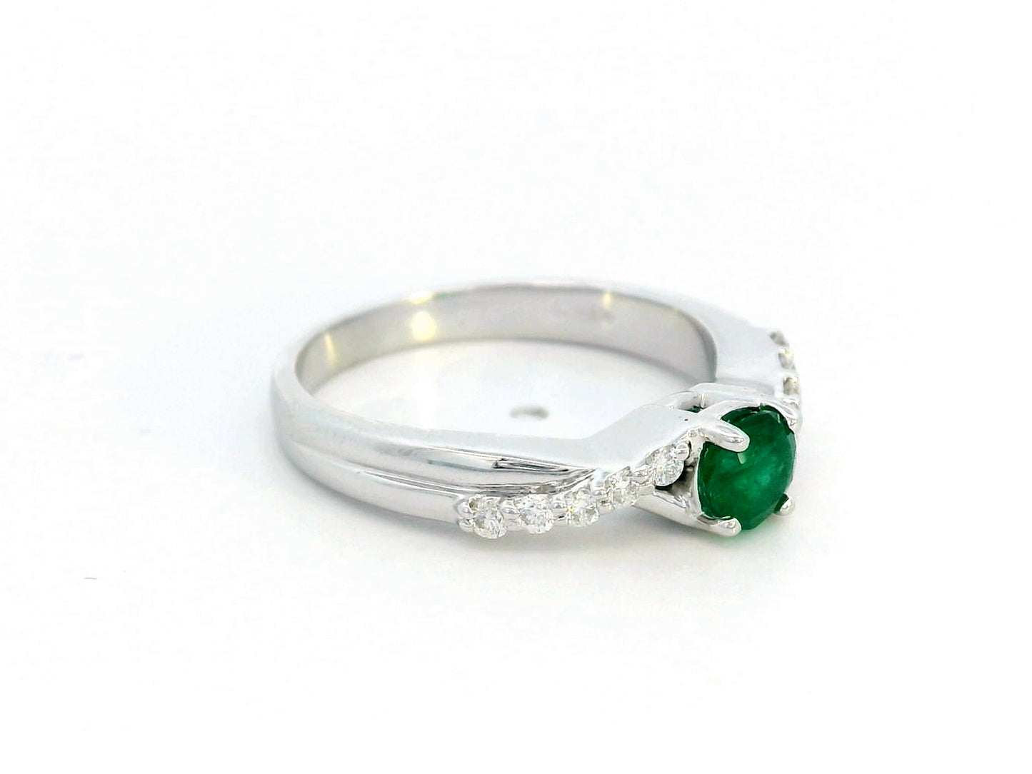 Round-cut 0.38-carat Emerald ring with 0.15-carat diamond accents in 18K gold, crossover band – May birthstone fine jewelry, engagement or cocktail ring.