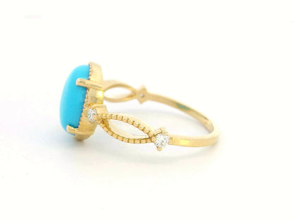 18K gold oval turquoise ring with diamond accents and vintage milgrain openwork design

