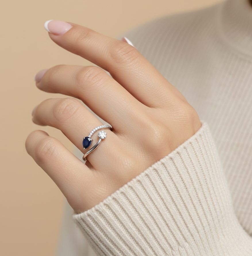 18K white gold bypass ring with 0.54ct pear blue sapphire and 0.14ct diamonds – Emirates Diamonds