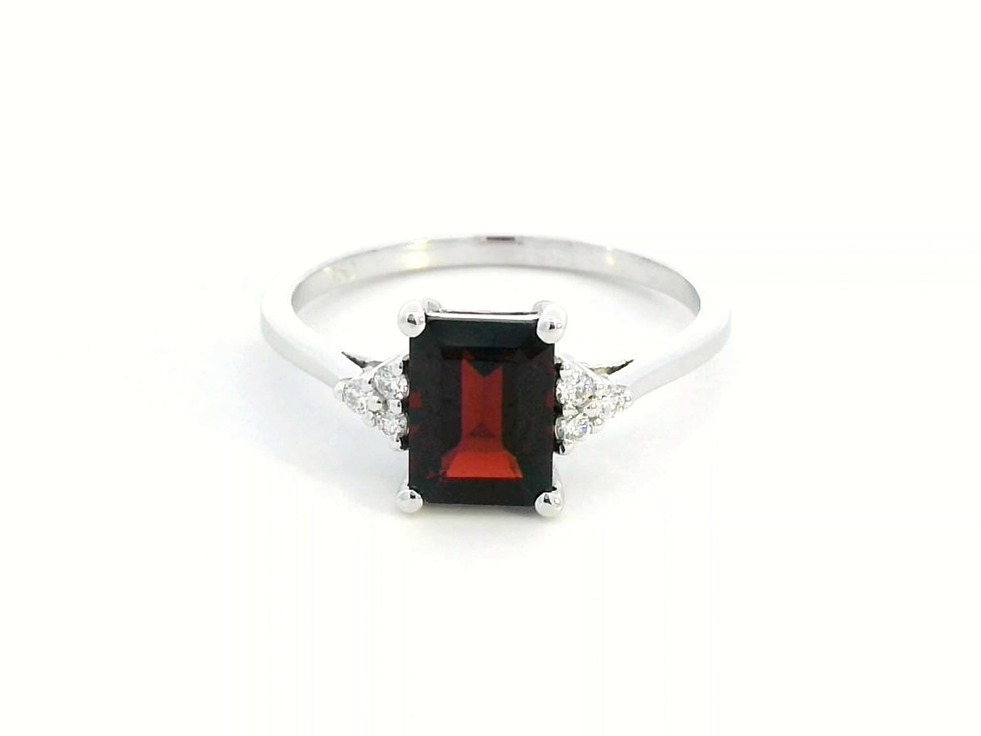 Emerald-cut 1.79-carat Garnet ring with 0.08-carat diamond accents in 18K gold – a stunning January birthstone jewelry piece