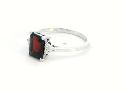 Emerald-cut 1.79-carat Garnet ring with 0.08-carat diamond accents in 18K gold – a stunning January birthstone jewelry piece