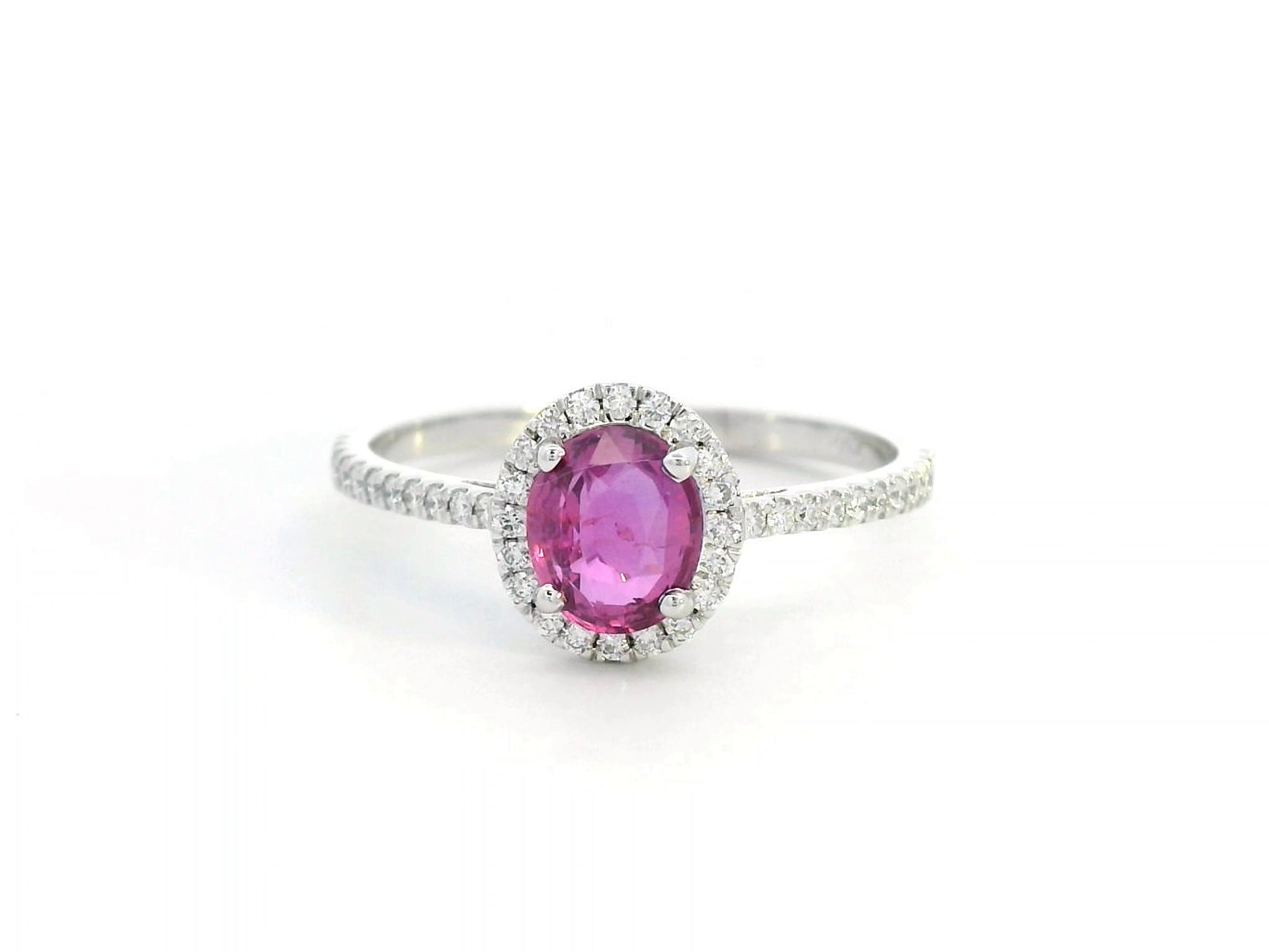 18K gold pink sapphire halo ring with 0.99 Ct oval pink sapphire and 0.22 Ct diamond accents, luxury gemstone jewelry