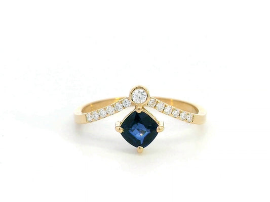 18K gold blue sapphire and diamond ring featuring a 0.51 carat cushion-cut sapphire and 0.14 carats of round-cut diamonds, set in an elegant design. Perfect for special occasions and fine jewelry lovers